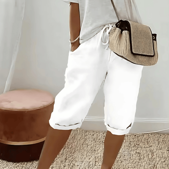 Solid color women's high-rise cotton linen knee-length harem shorts, ideal for summer fashion