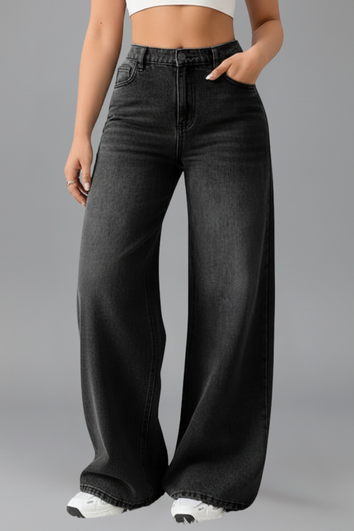Classic blue women's denim jeans, featuring a high-rise waist and fashionable wide-leg cut.
