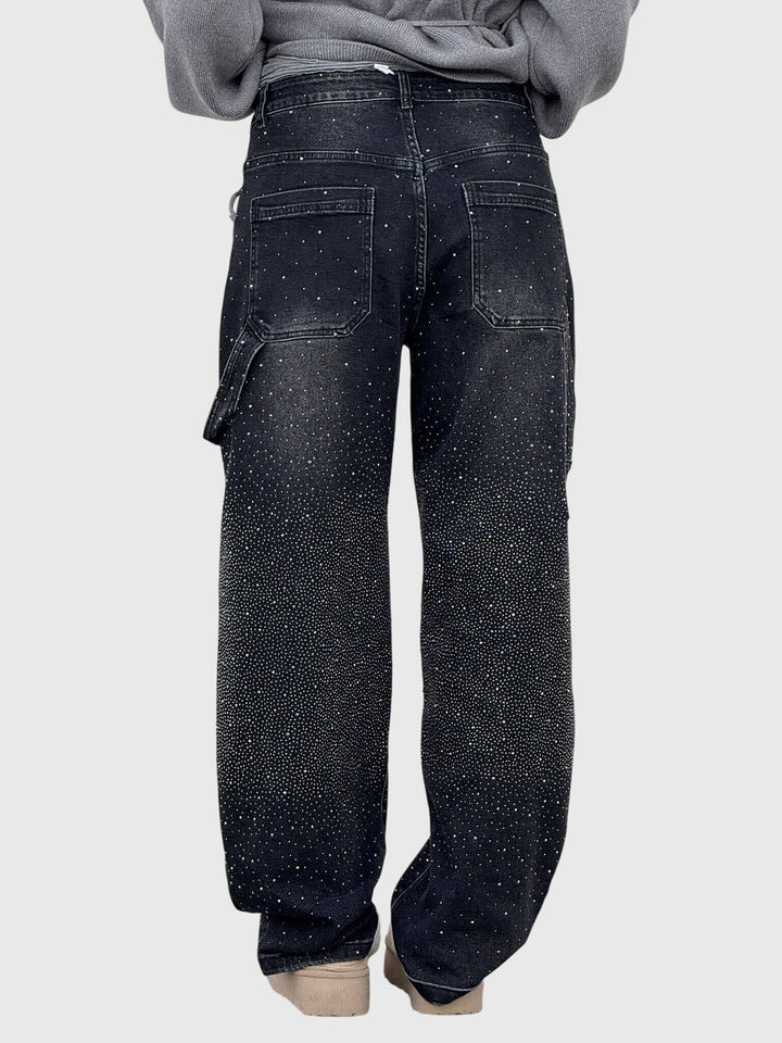 Hanging display of women's sparkle diamond wide-leg denim pants, ready for fashion.