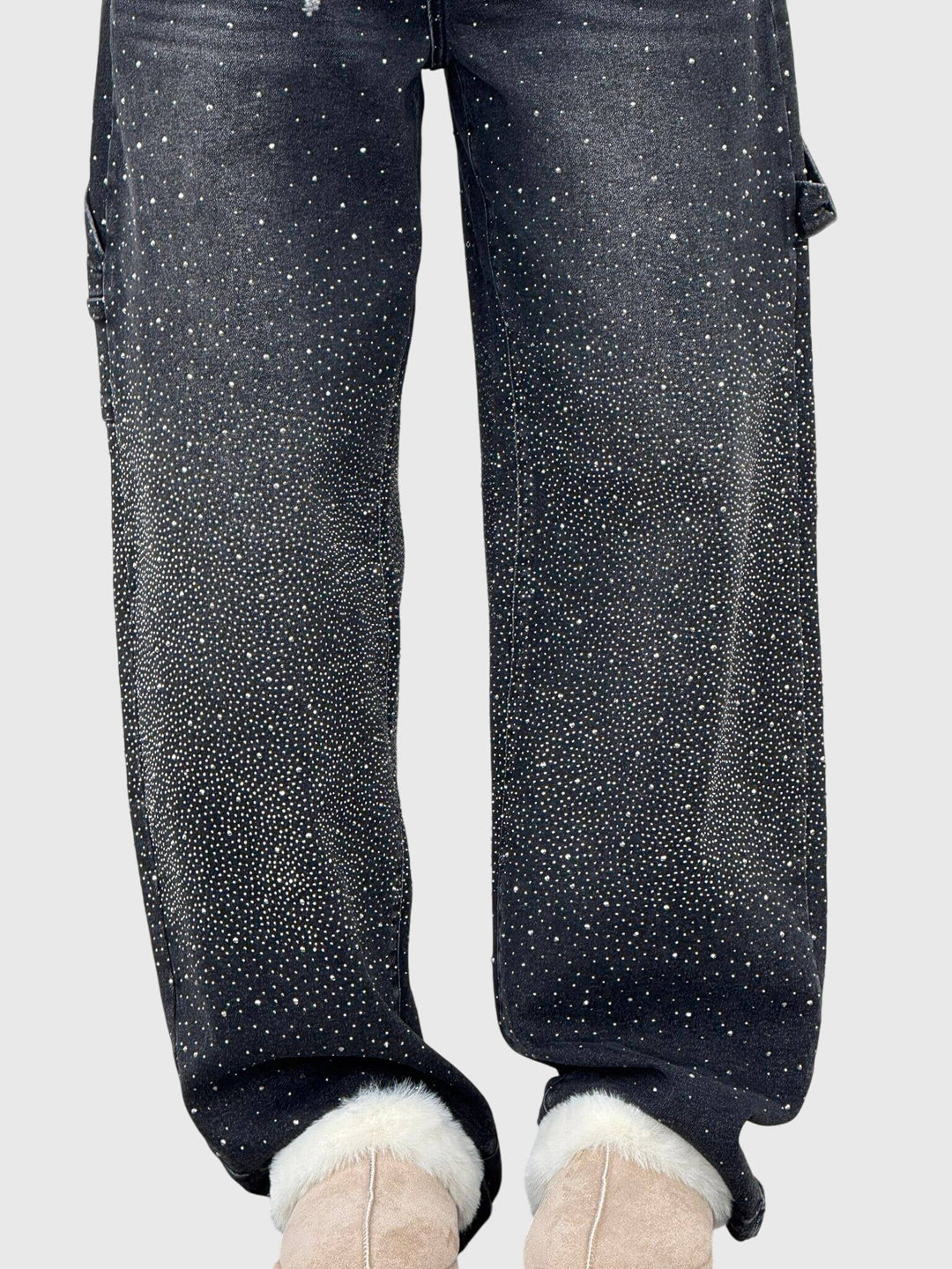 Pair of women's sparkle diamond wide-leg denim jeans folded, highlighting the fabric and design.