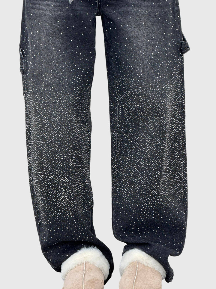 Pair of women's sparkle diamond wide-leg denim jeans folded, highlighting the fabric and design.