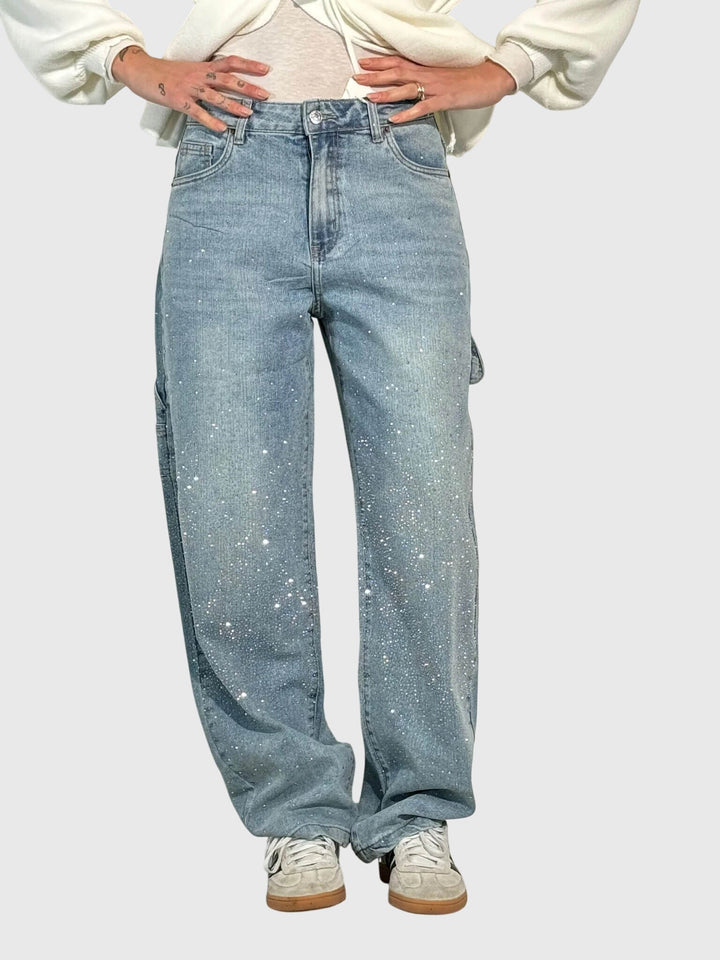 Back view of women's wide-leg denim pants featuring subtle sparkle diamond accents.