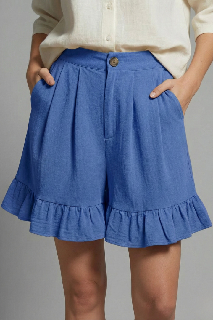 Hanging display of women's high waist casual summer shorts with delightful ruffle hems, ready for warm weather.