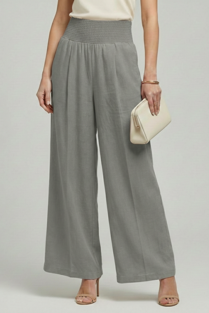Comfortable women's high-waisted pleated palazzo trousers, offering a wide-leg silhouette for summer wear.