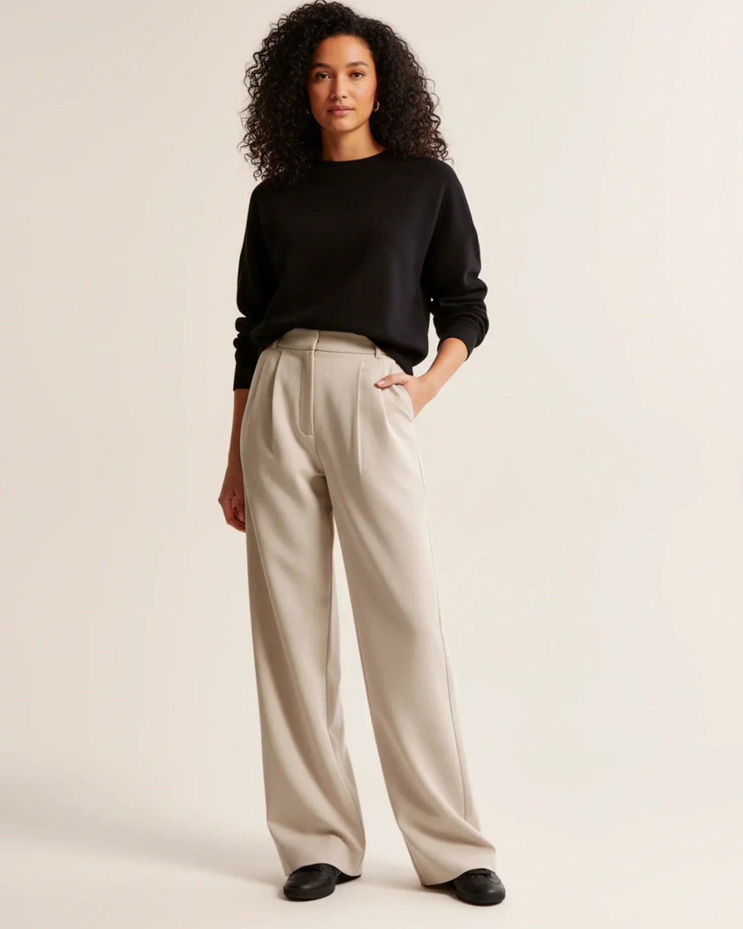 Women's high waist pleated tailored trousers in black, perfect for office wear or a smart casual look.