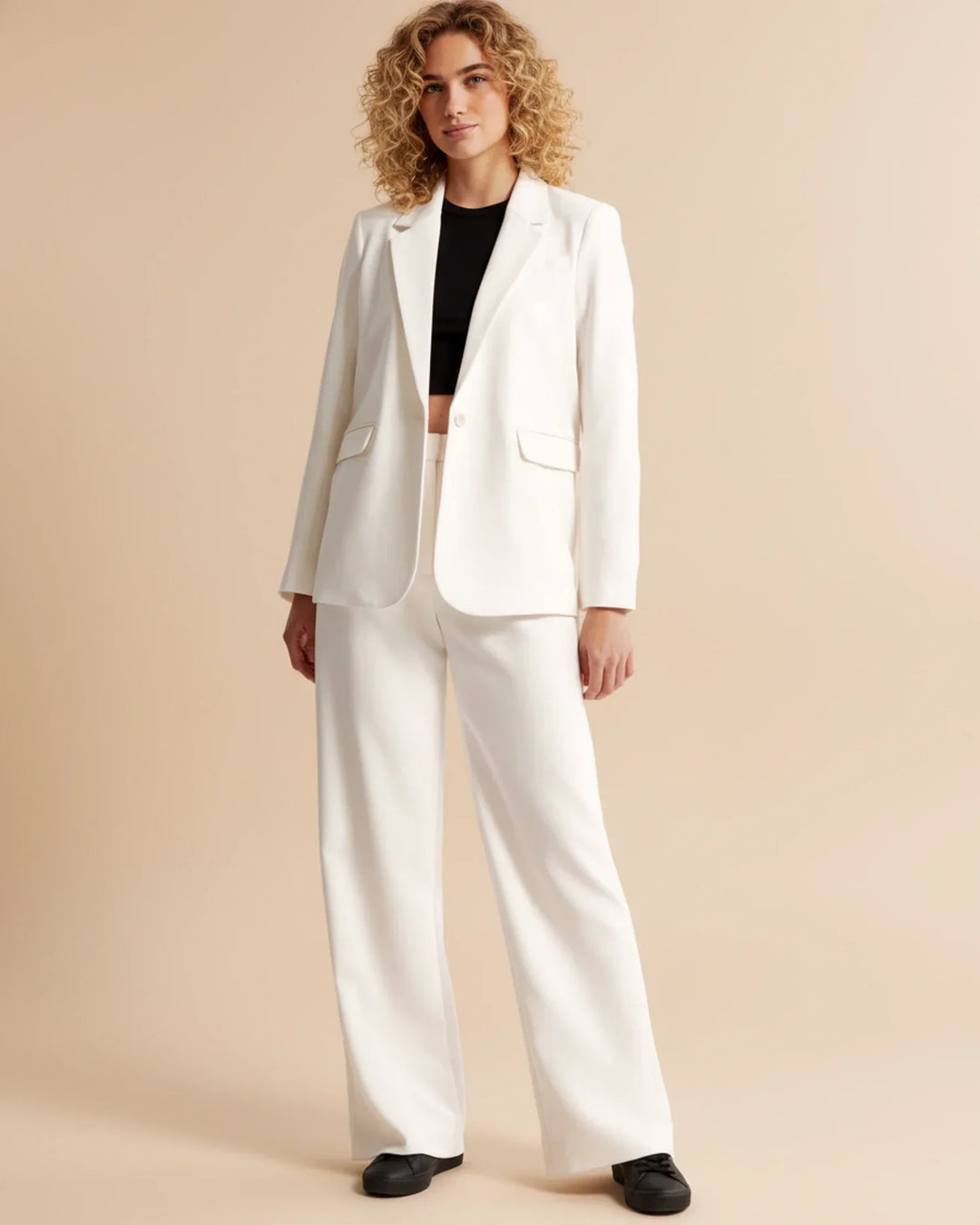 Women's fashion trousers: high waist pleated tailored trousers in a vibrant burgundy color.
