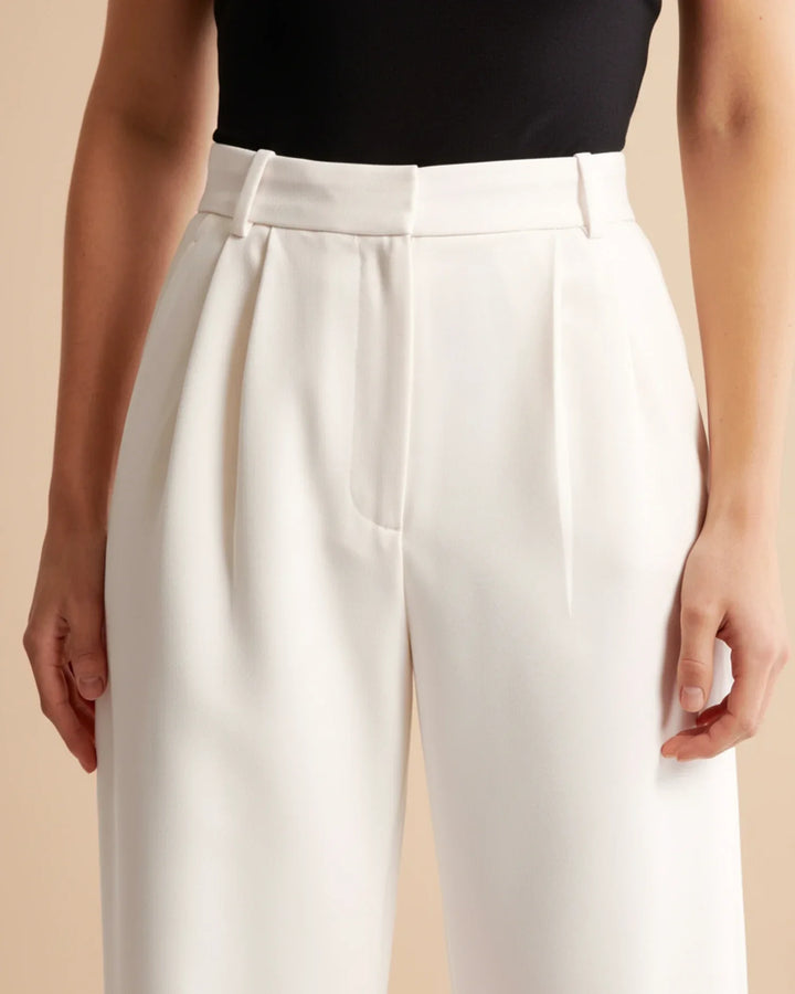 Relaxed fit green high waist pleated tailored trousers for women, blending comfort and style.