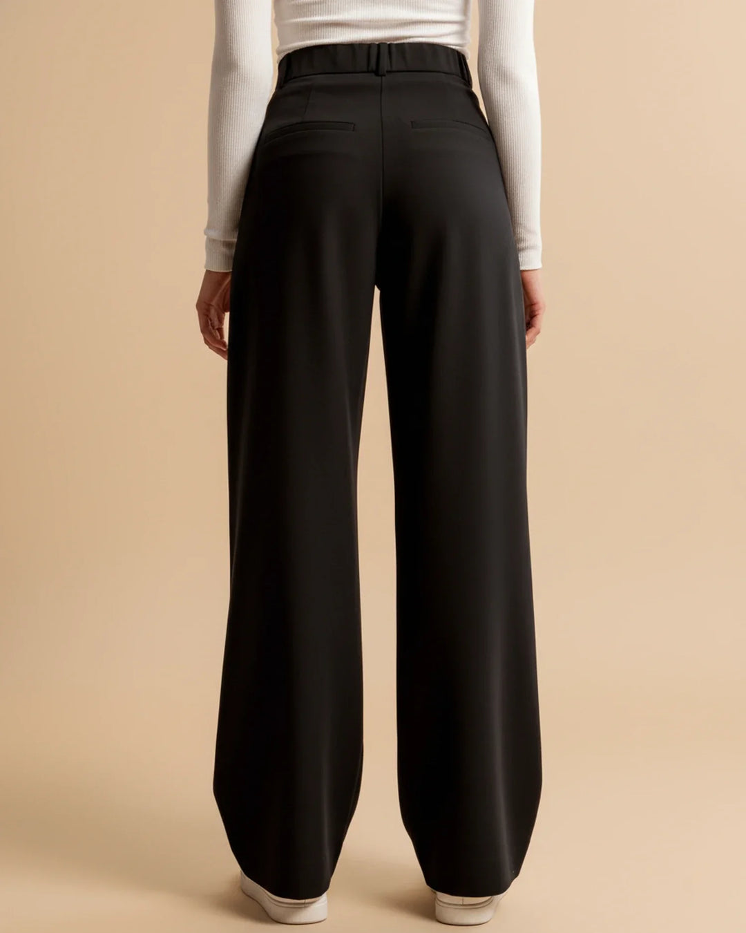 Women's high-waisted pleated comfort trousers in a soft pastel shade, suitable for all-day wear.
