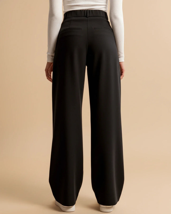 Women's high-waisted pleated comfort trousers in a soft pastel shade, suitable for all-day wear.