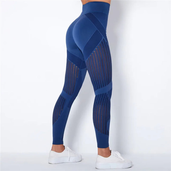 Detail shot of the seamless construction and high-waist band of women's sculpting yoga leggings.