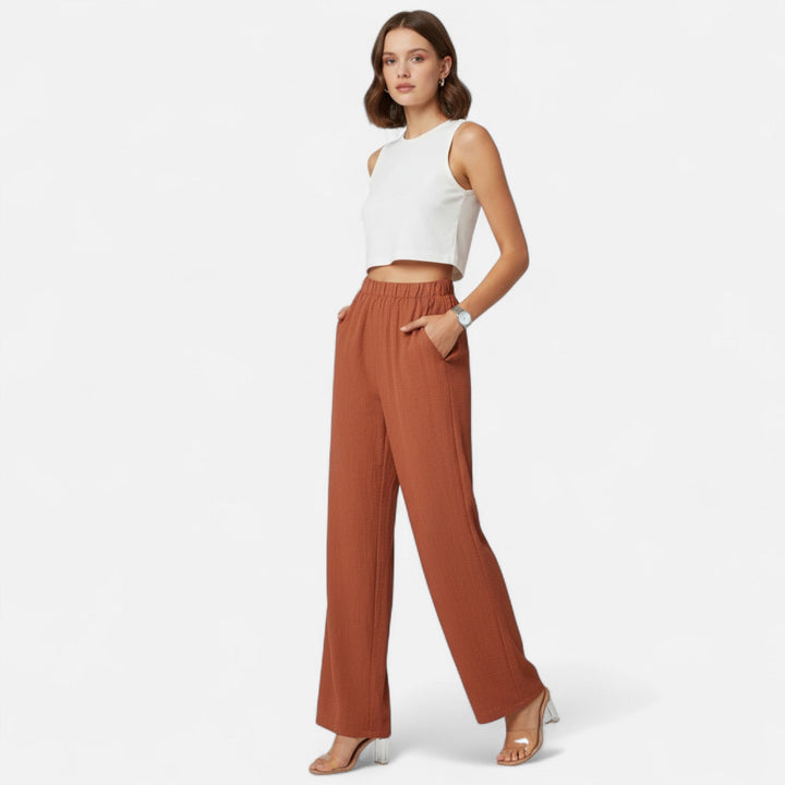 Black straight-leg tailored trousers, high-waist, perfect for versatile office wear.