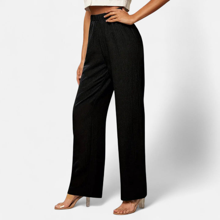 Tailored navy straight-leg trousers with a flattering high-waist, suitable for versatile styling and office wear.