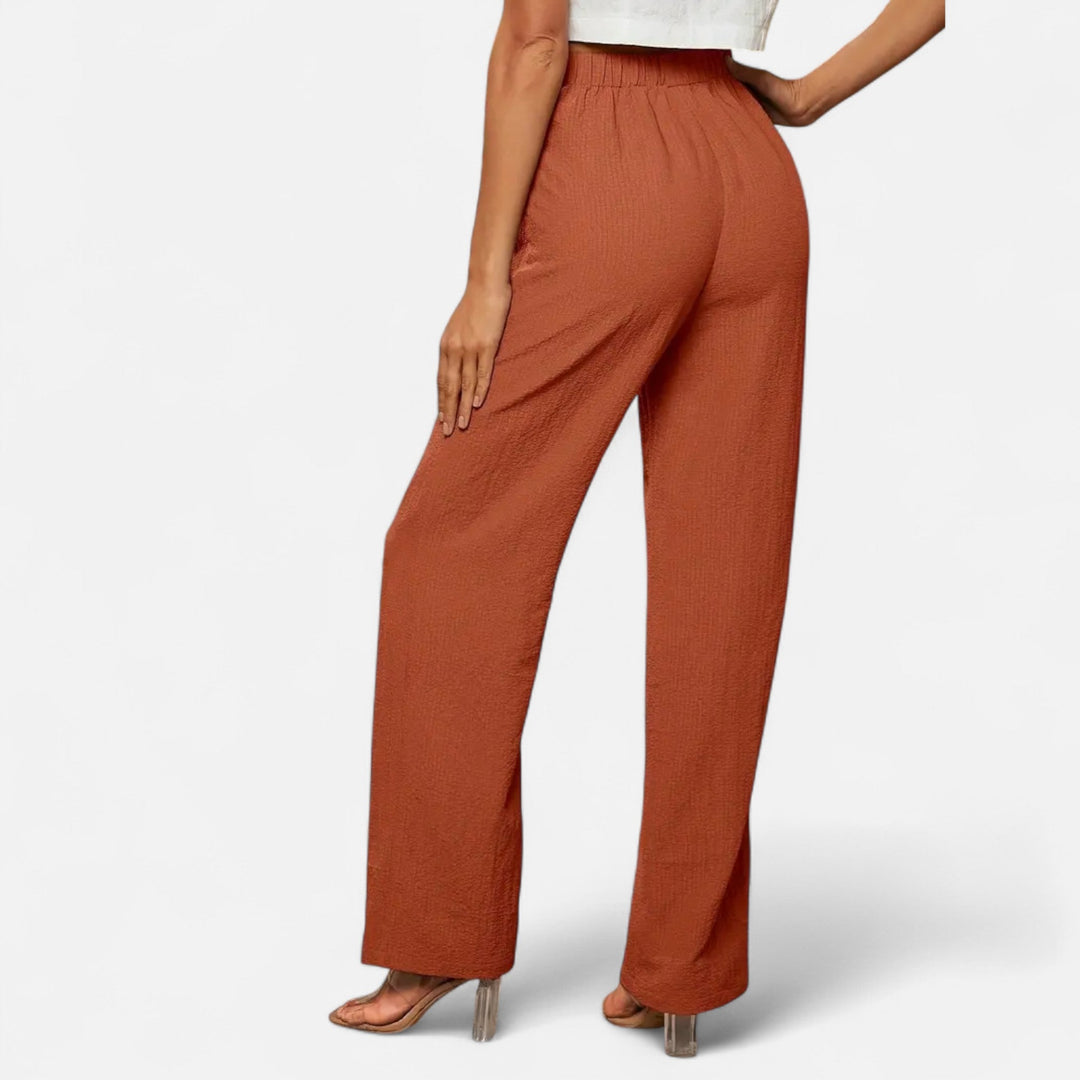 Straight-leg women's pants with a chic high-waist, offering a comfortable, classic silhouette.