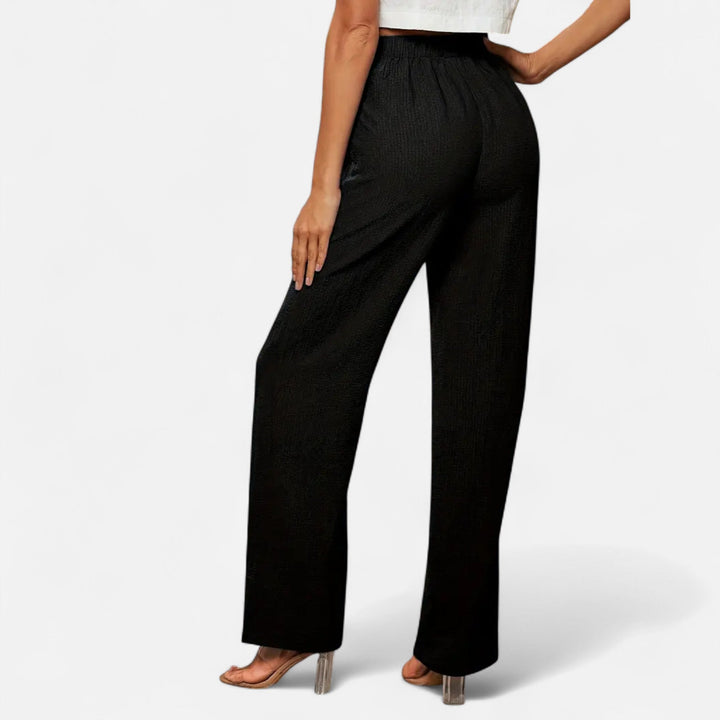 Professional black high-waist straight-leg pants, a comfortable choice for modern office wear.
