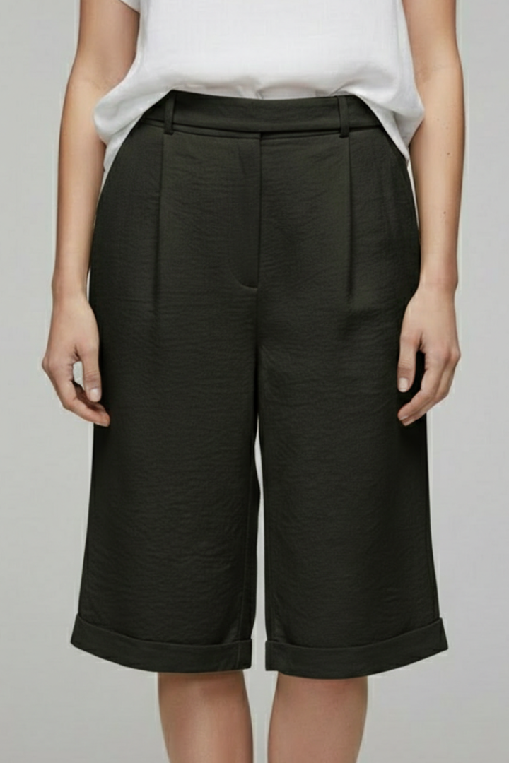 Front view of women's casual high-waist cuffed shorts, emphasizing the tailored details.