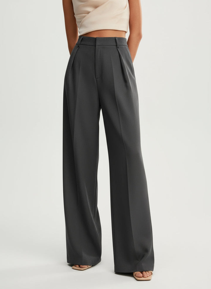 Smart casual women's trousers with a high waist and flowy wide leg, expertly tailored for comfort and style.