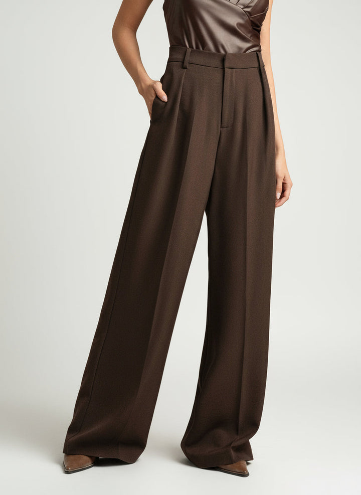 Fashion-forward women's tailored wide leg pants with a high waist, offering an elegant, modern aesthetic.