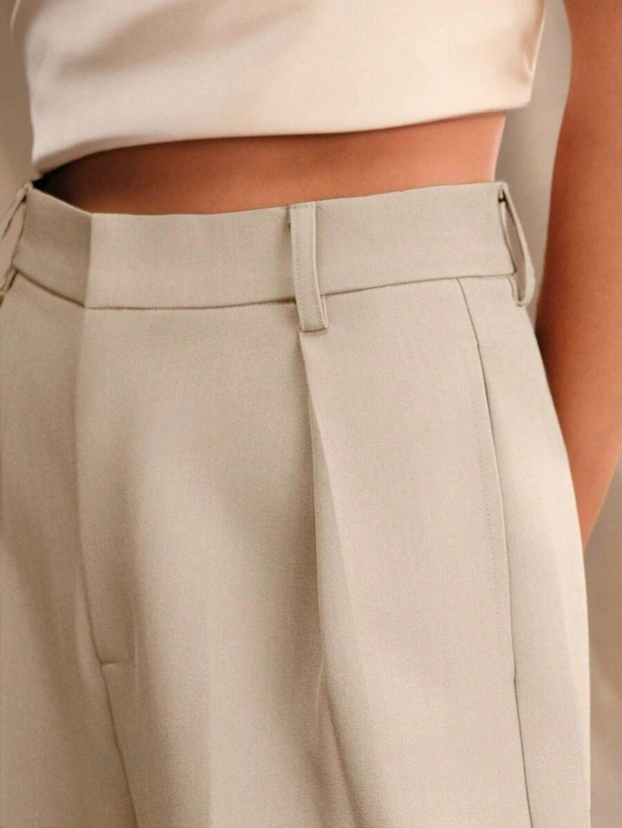 Classic women's dress pants: high waist, wide leg silhouette, and a sharp tailored finish.