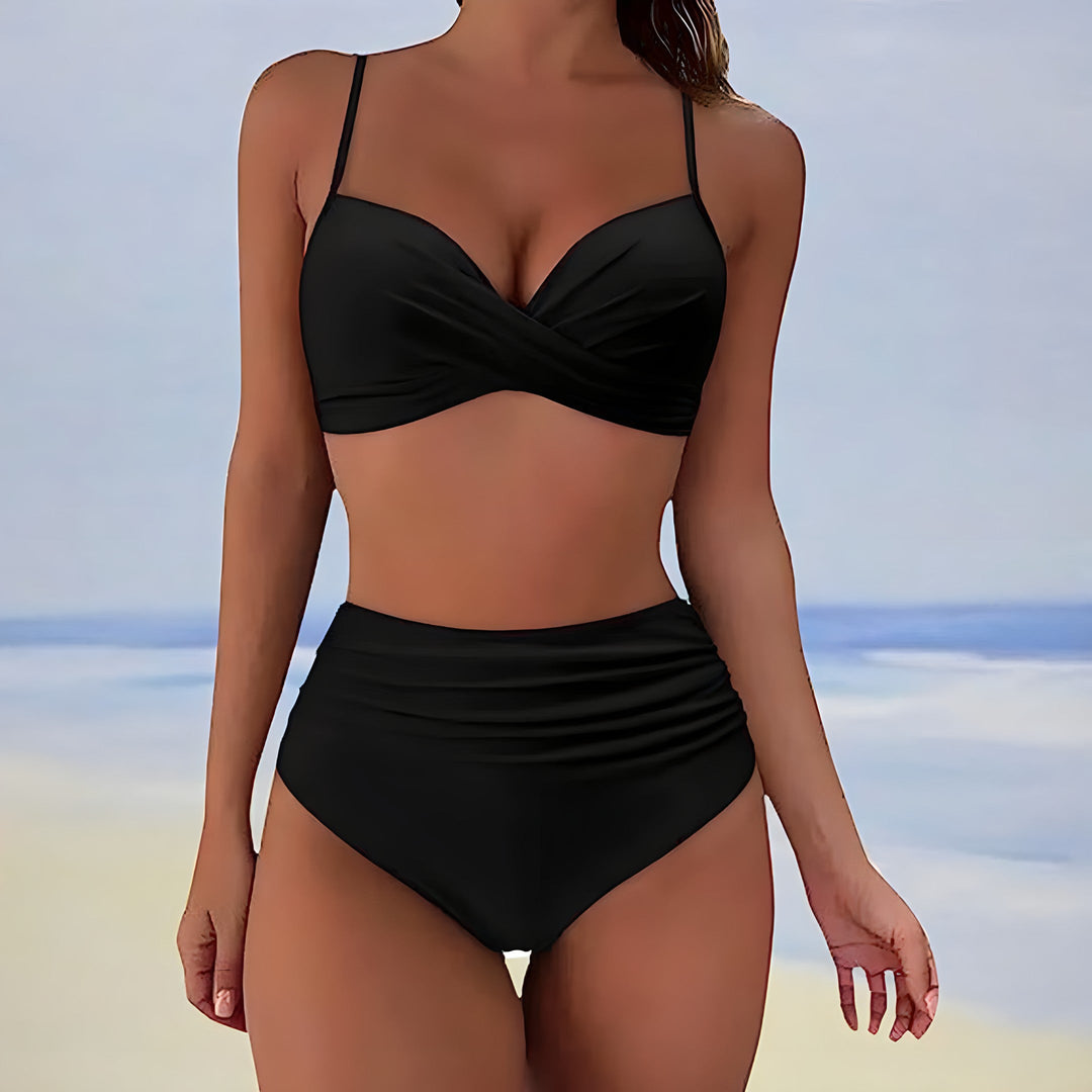 Flattering two-piece women's swimwear: high-waisted bottoms & supportive twist-front bikini top, perfect for summer.