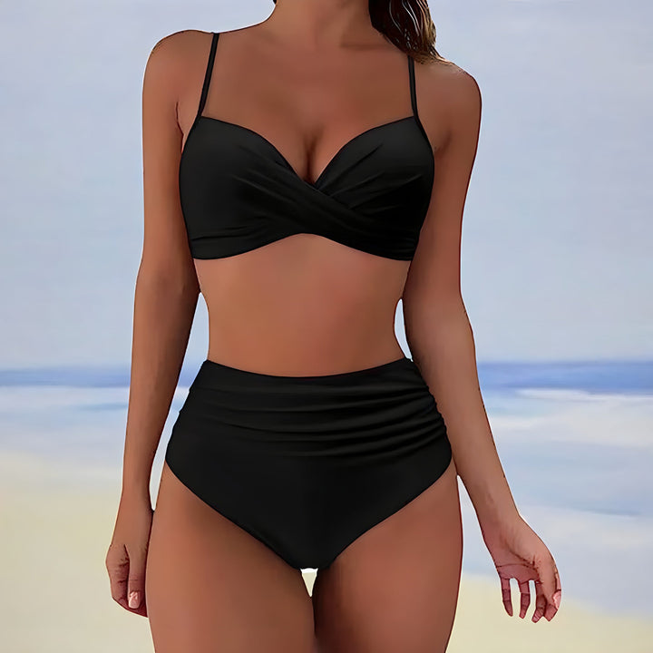 Flattering two-piece women's swimwear: high-waisted bottoms & supportive twist-front bikini top, perfect for summer.