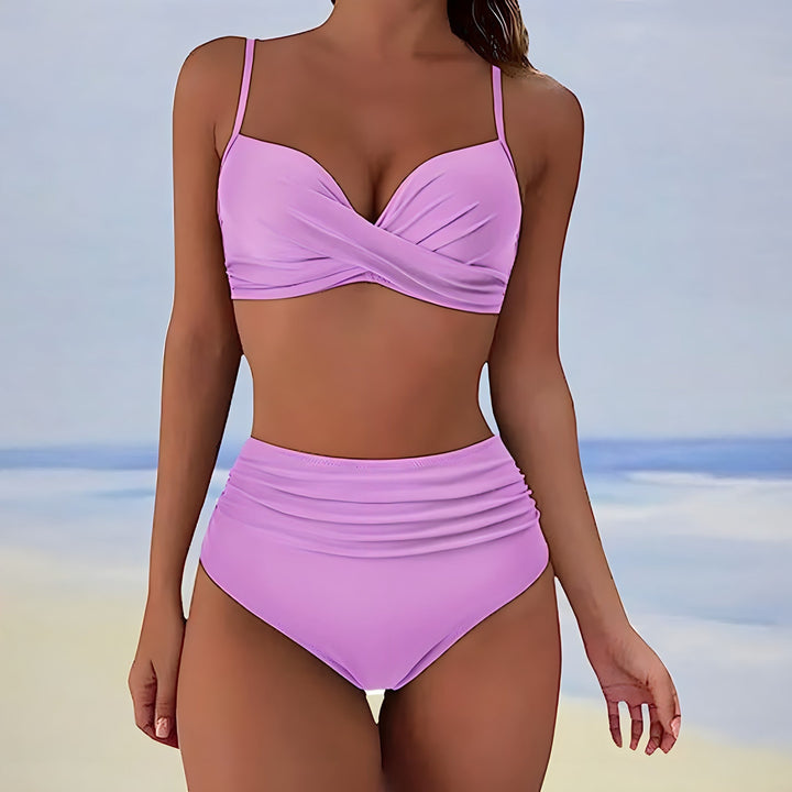 Summer fashion: women's high-waisted bikini set with a supportive twist-front top and flattering design.