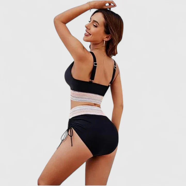 Vibrant women's high-waisted bikini, a perfect summer swimsuit for enjoying the sun and water in style.