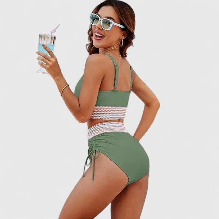 Contemporary womens beachwear: a high-waisted bikini and v-neck top for a confident and fashionable summer look.