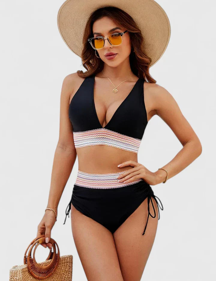 Elegant women's high-waisted bikini, designed for comfort and style as beachwear or poolside attire.