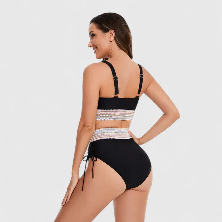 Dynamic two-piece women's swimwear: high-waisted bikini with a comfortable v-neck top for active summer days.