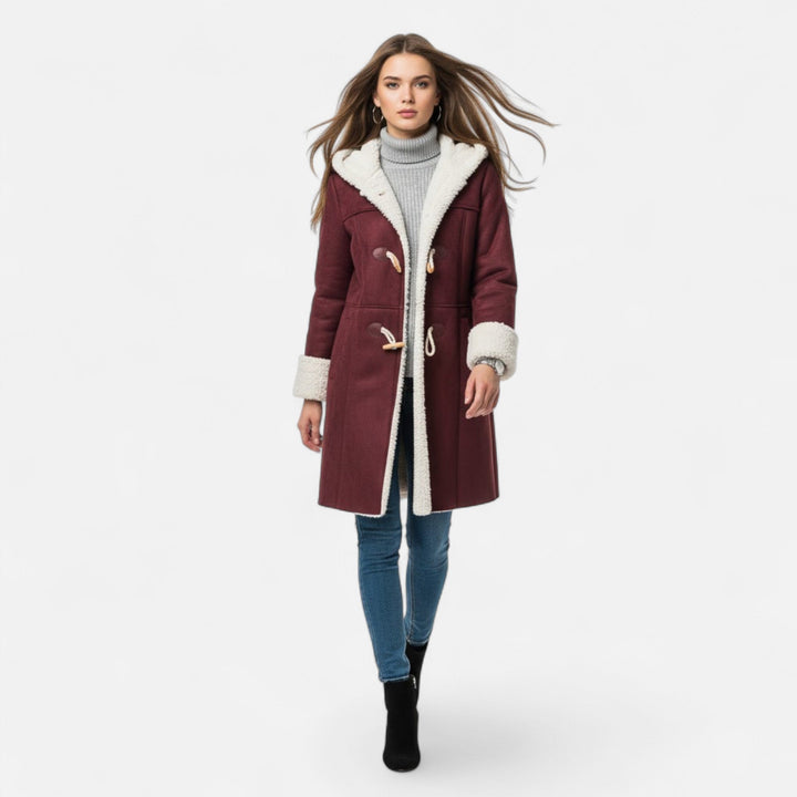 Sophisticated women's button-front winter coat, hooded design for elegant cold-weather style.
