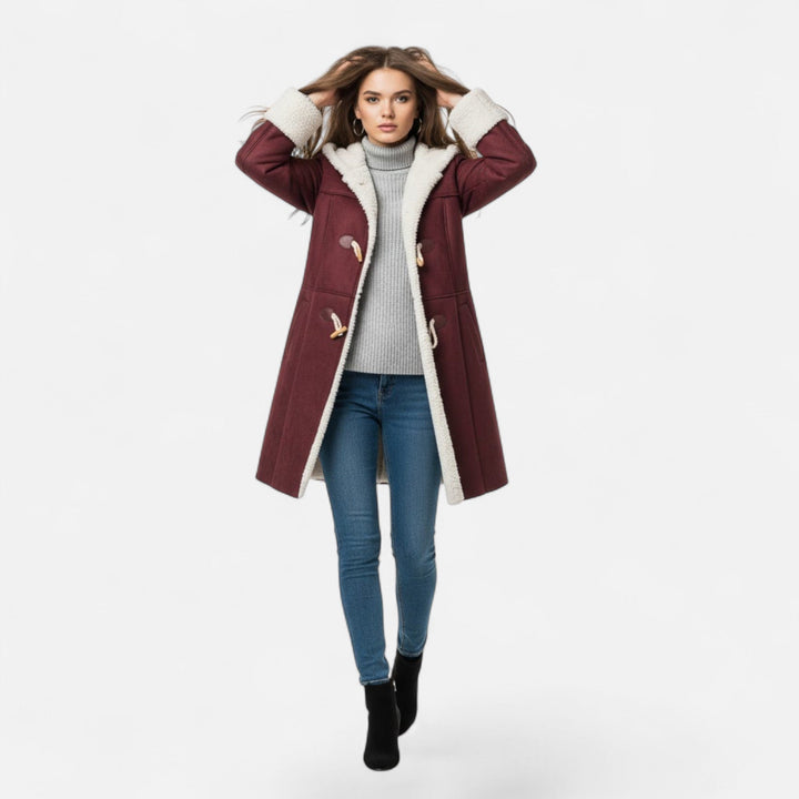 Practical women's hooded winter coat, button-front and pockets, offering warmth and utility.