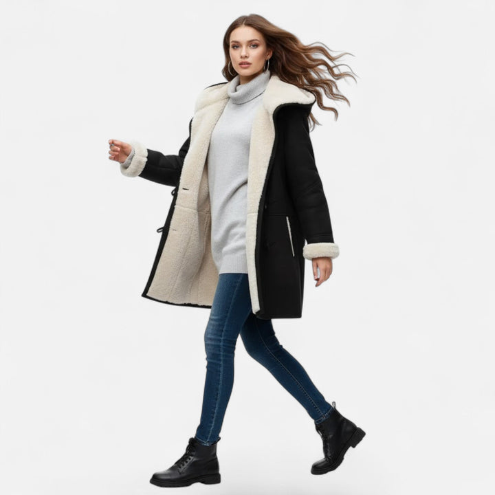Women's warm long winter coat, hooded and button-front with functional pockets.