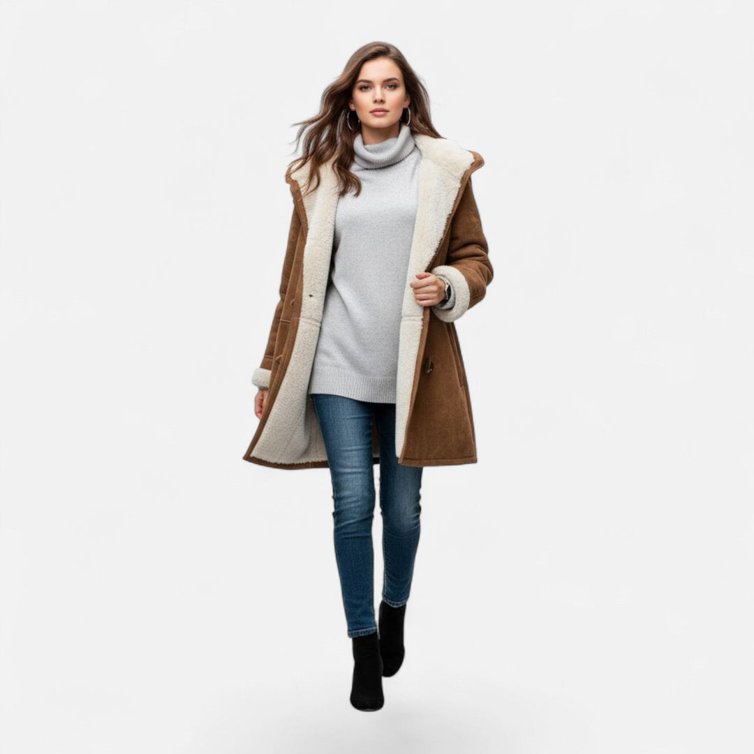 Durable women's hooded button-front winter coat, designed for maximum warmth in cold weather.