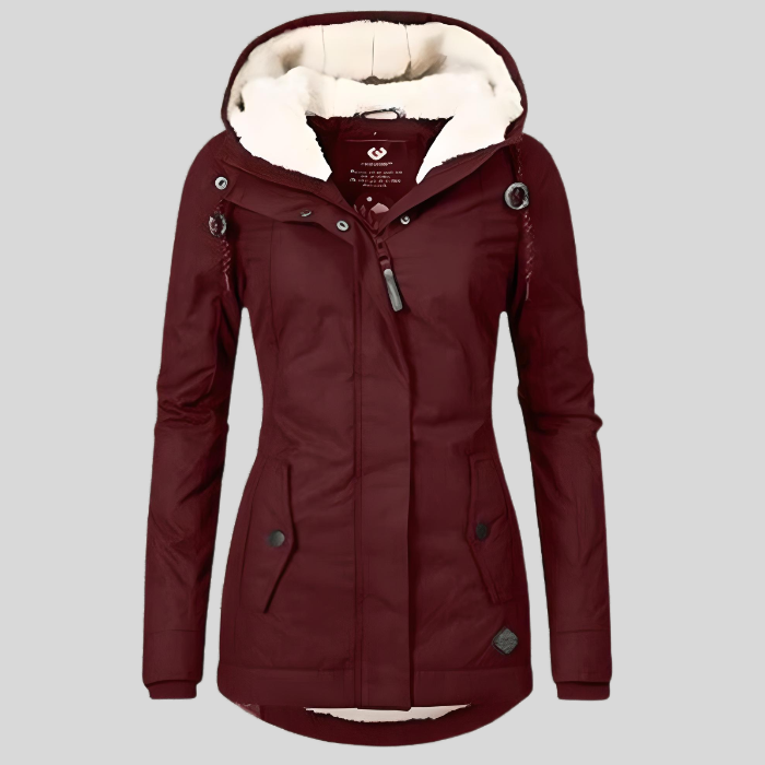 Versatile women's outerwear: a hooded waterproof rain jacket, essential for all weather and travel.