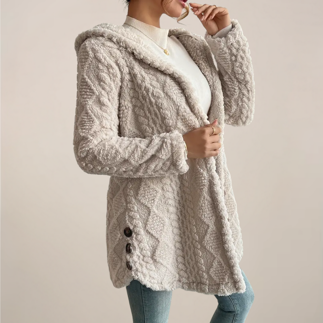 Spring fashion women's cozy hooded cardigan with unique textured knit, ideal casual layering piece.
