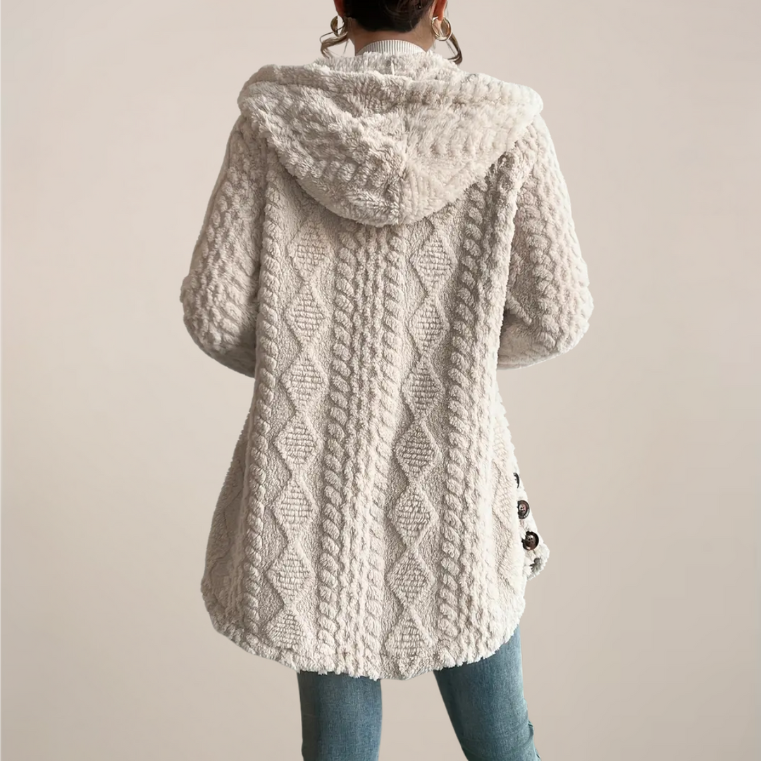 Soft fabric women's hooded cardigan, a textured knit layering piece for comfortable spring everyday style.