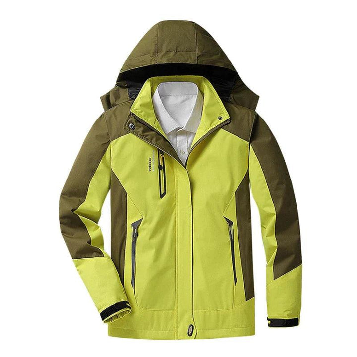 Woman wearing a blue hooded waterproof jacket, ready for diverse outdoor winter fashion.