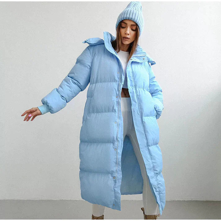 Close-up of a women's warm hooded winter coat fabric, showcasing durable puffer material