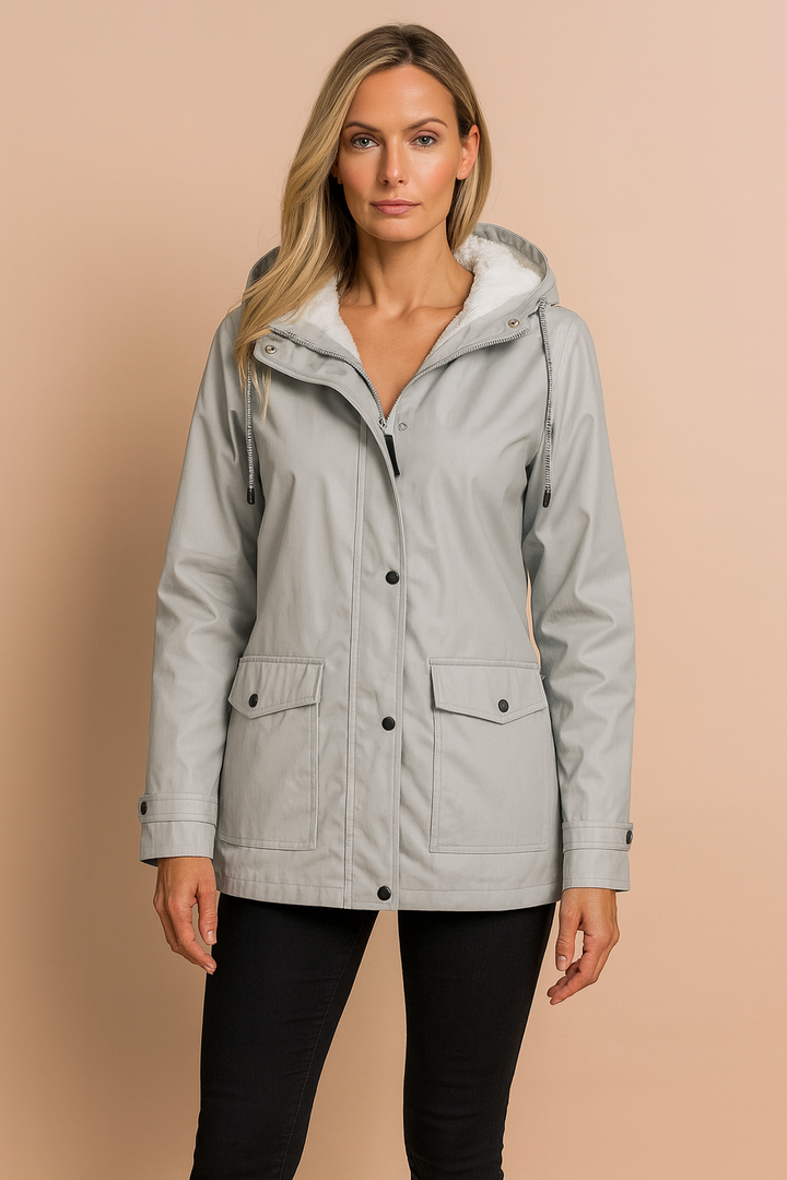 Warm women's jacket with hood, insulated for cold weather. A cozy and casual winter fashion essential.