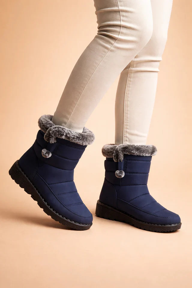 Durable women's winter boots, insulated and slip-resistant, ideal for outdoor activities in cold, snowy conditions.