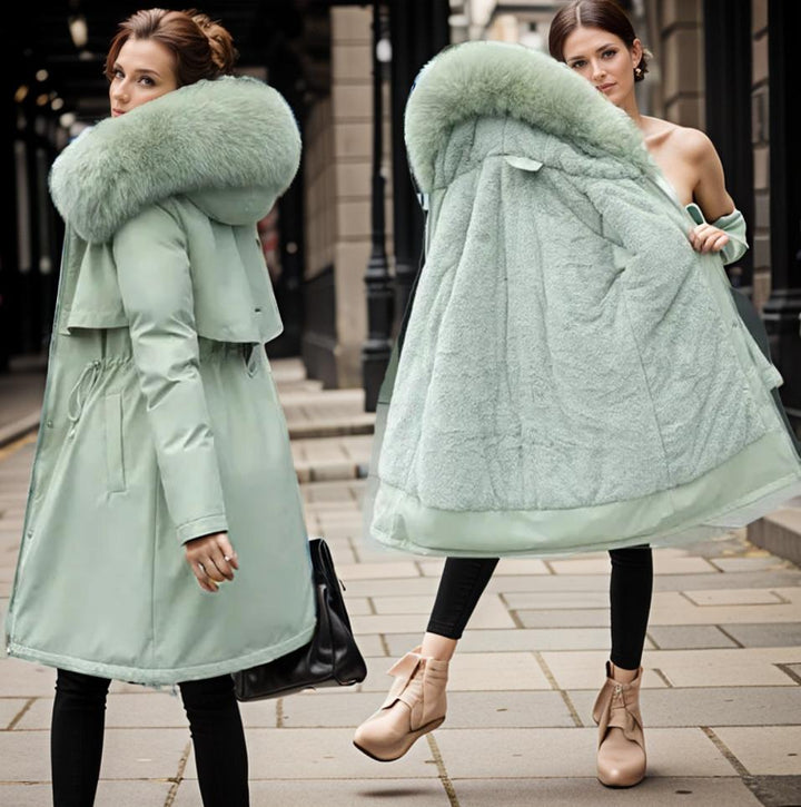 Front view of women's insulated long winter parka. Features a warm plush hood and durable waterproof fabric.