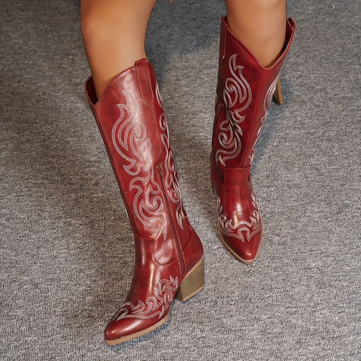 Side profile of women's fashion cowboy boots, knee-high, sturdy block heel, stylish & unique.