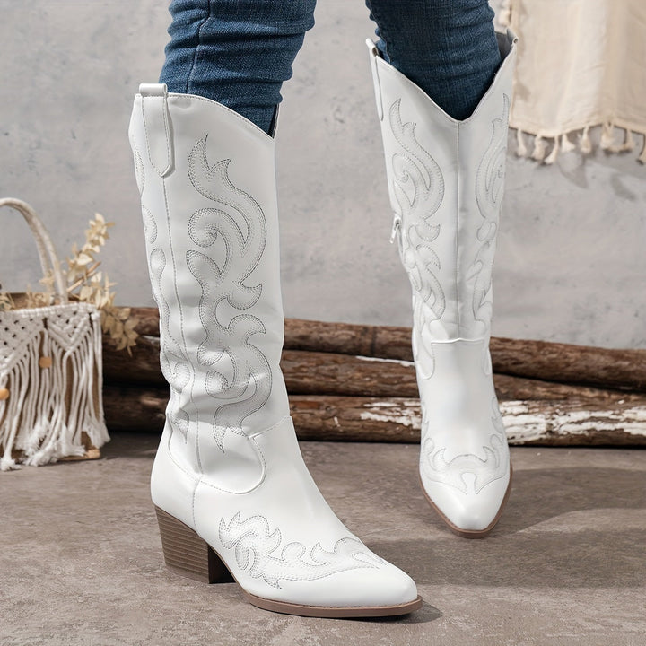 Full length shot of women's knee-high cowboy boots, sleek design, supportive block heel.