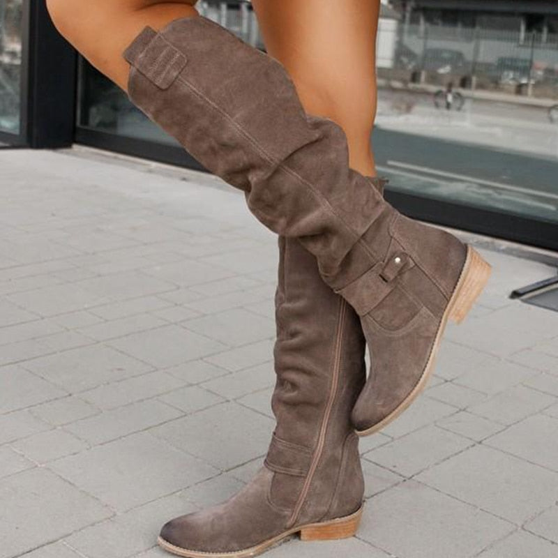 Black women's riding boots, knee-high with decorative buckles and functional side zipper detail