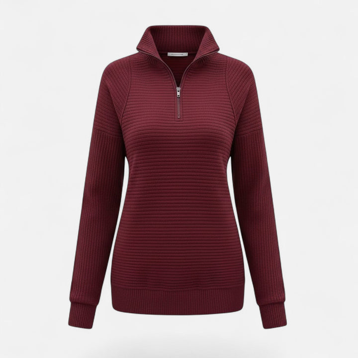 Chic women's knit sweater in a neutral tone, with a stand-collar and convenient zipper.