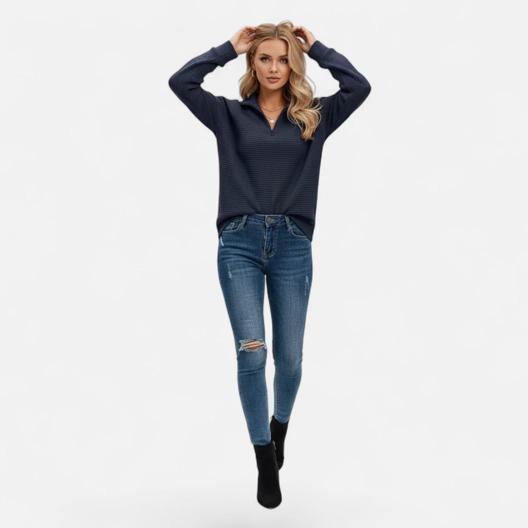 Modern women's stand-collar knit sweater with a functional front zipper.