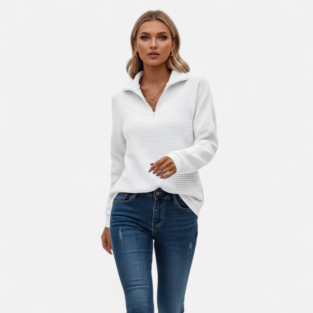 Stylish women's pullover knit sweater with a functional zipper and stand collar.