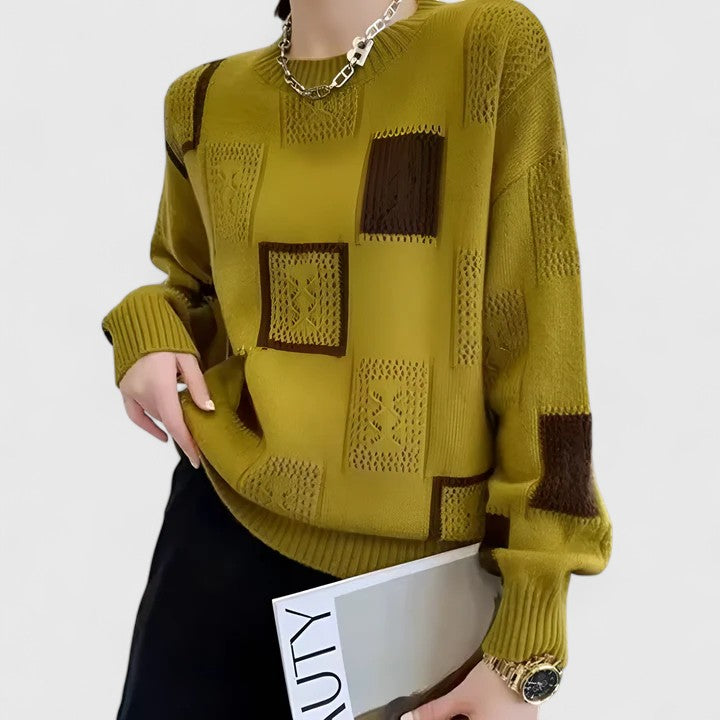 Close-up of a women's knitted openwork round neck sweater, perfect for winter