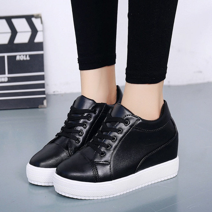 Versatile women's platform sneakers with a hidden wedge. Modern casual footwear for comfort & everyday style.