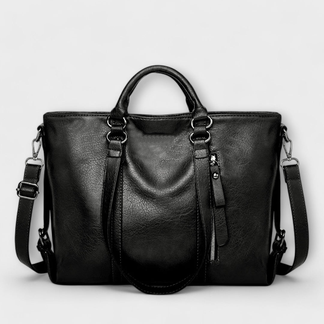 Stylish women's black leather shoulder bag with ample space for essentials, a versatile accessory.
